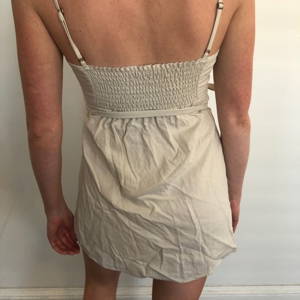 Adorable cut out beige wrap dress